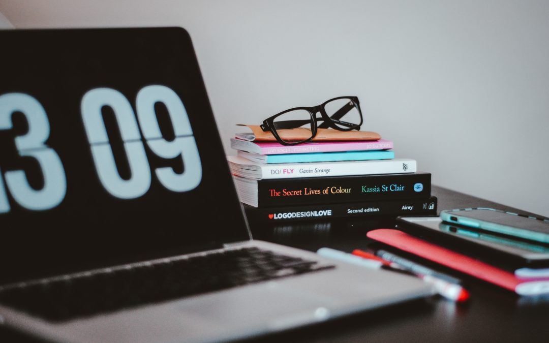 digital clock and books